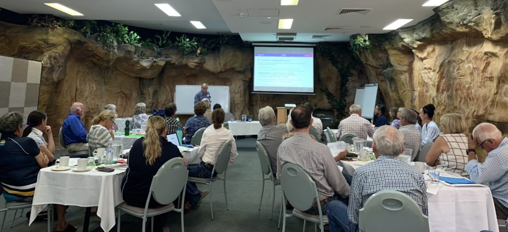 Attendees in an interesting looking conference room look towards the presenter at the Phosphorus Management workshop.