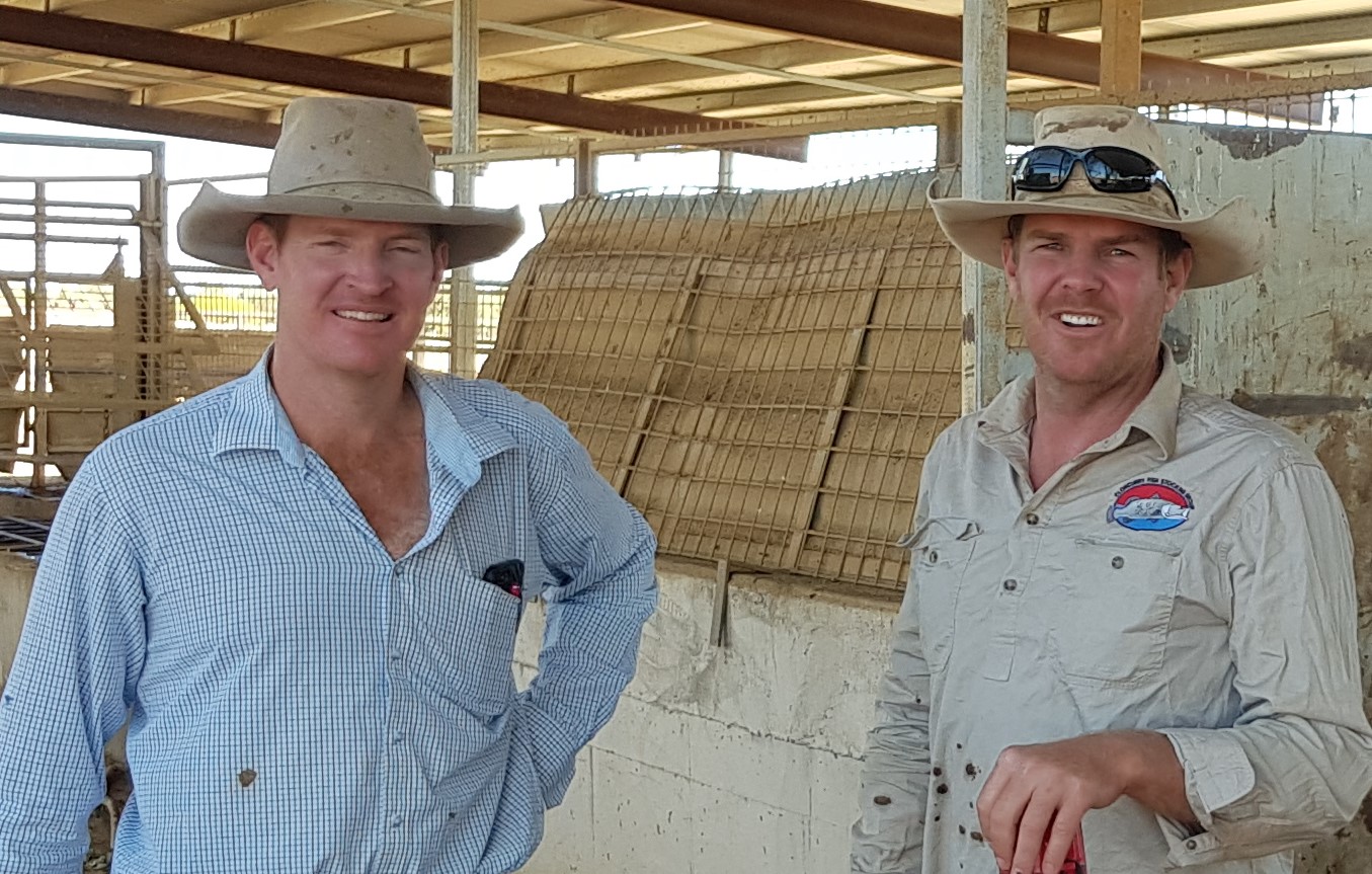 Two gentlemen in long sleeve shirts and broad brimmed hats 