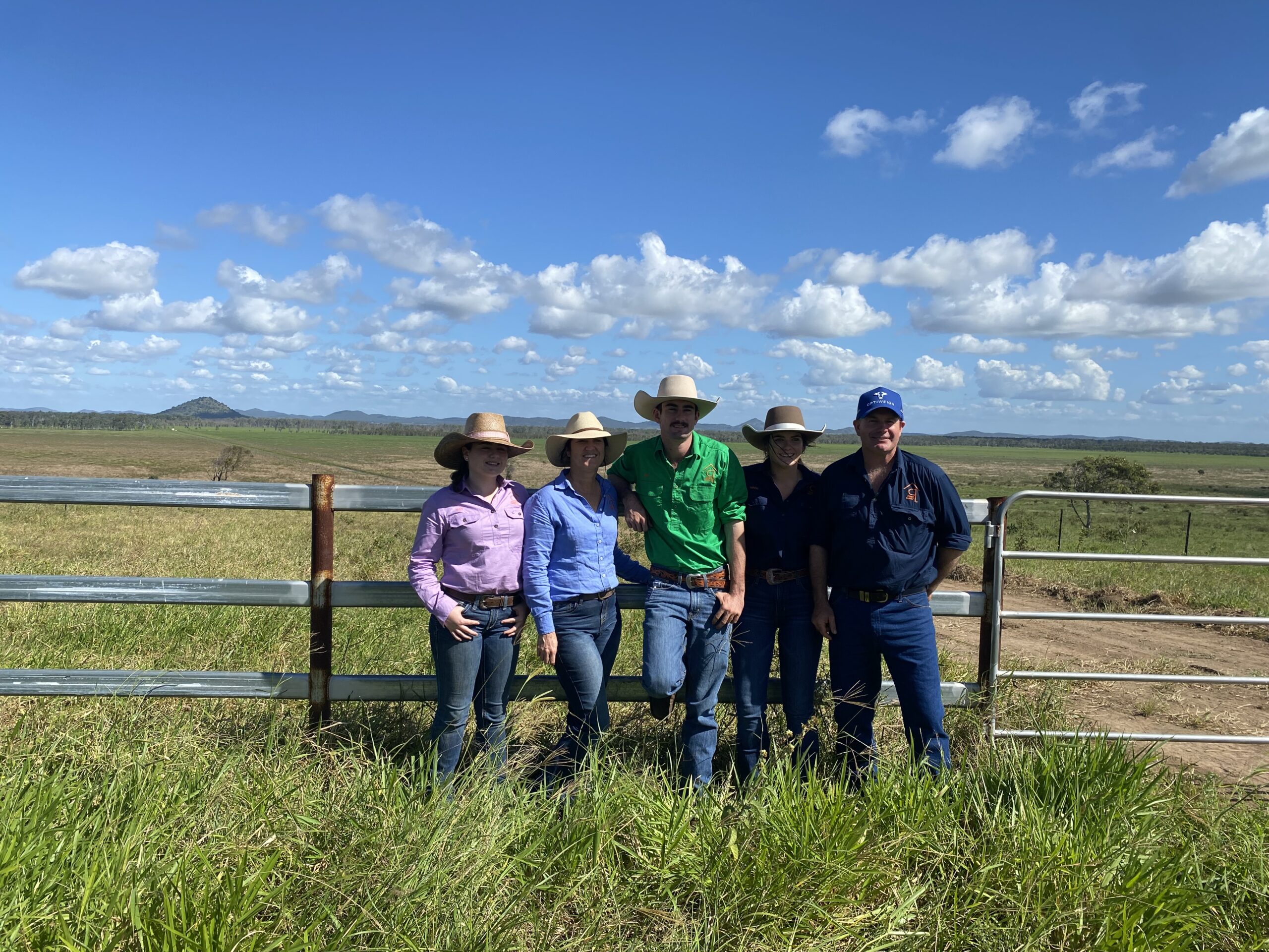 A family photo standing in the paddock.