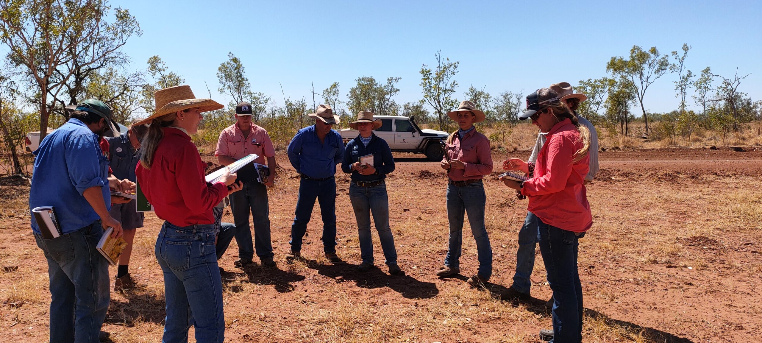 Rangeland Management Course attendees use species ID books to identify good species from the bad.