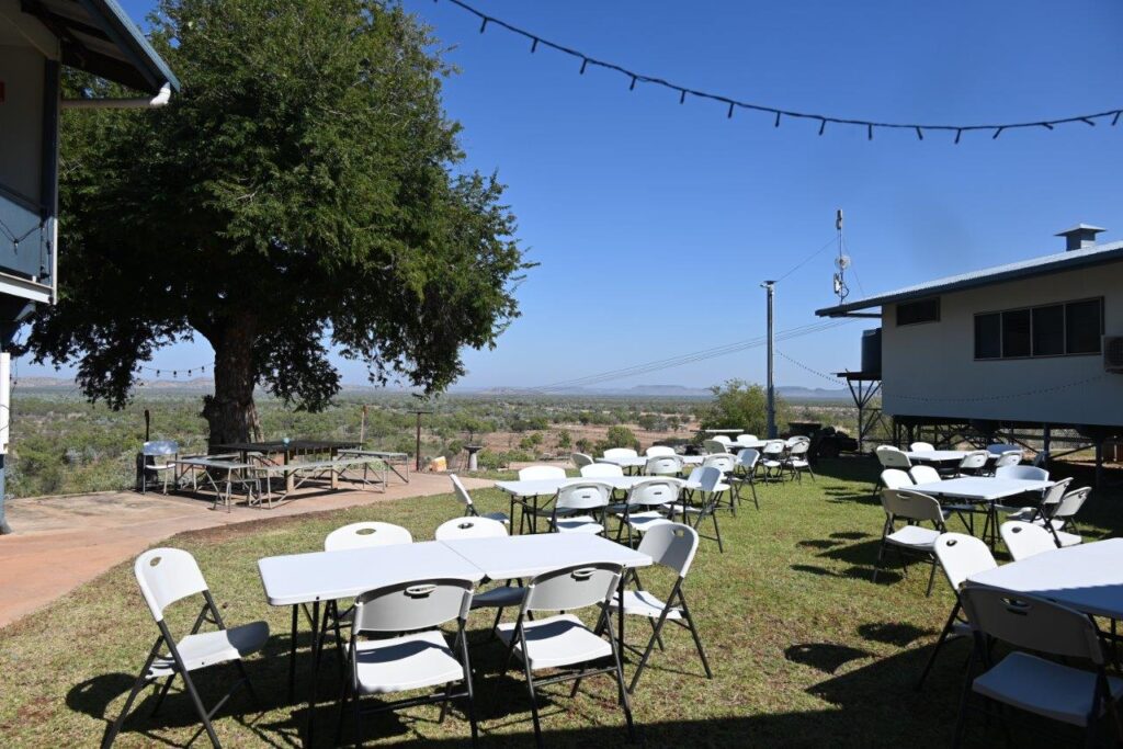 Photo of the gorgeous view from the dinner area with chairs and tables set up ready to go.