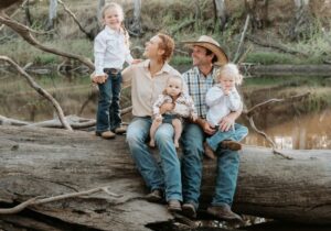 Justine and Matt McLeod with their family on their grazing property near Goovigen