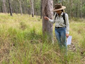 Renee Ould from Healthy Land & Water out on property with land type sheets. 