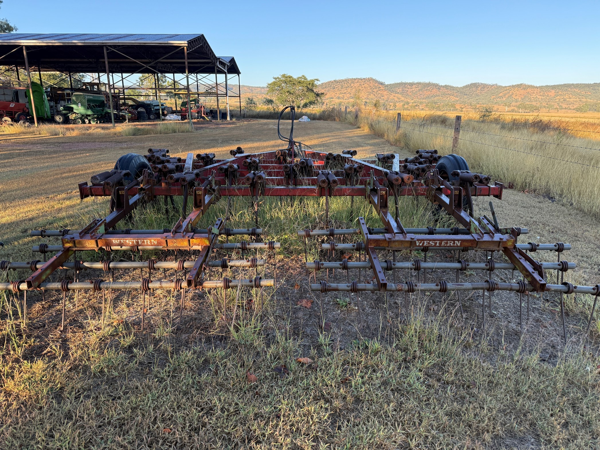 Rear view of scarifier showing smaller tines that sit behind the large spring loaded tines.